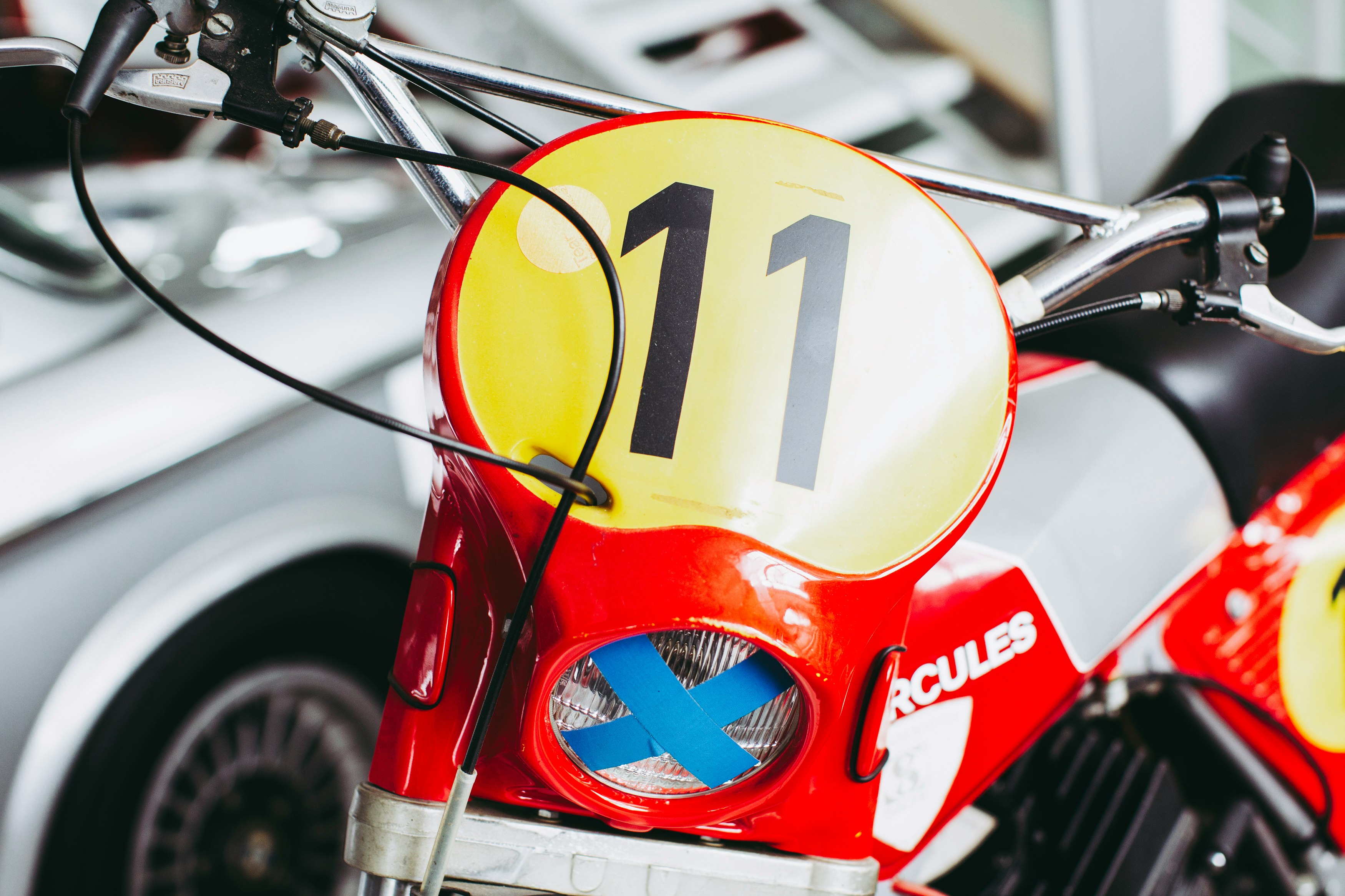 red and yellow motorcycle with black and white arrow sign